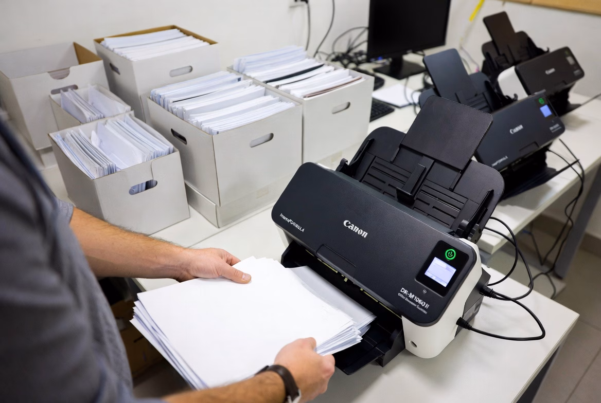 High-volume document scanning operation with multiple Canon scanners processing banker boxes of records at Overland Printing Phoenix