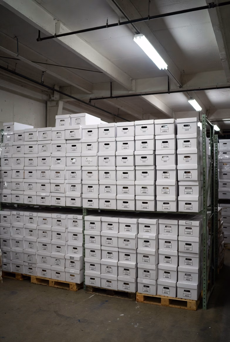 Warehouse filled with banker boxes of documents awaiting scanning at Overland Printing Phoenix facility